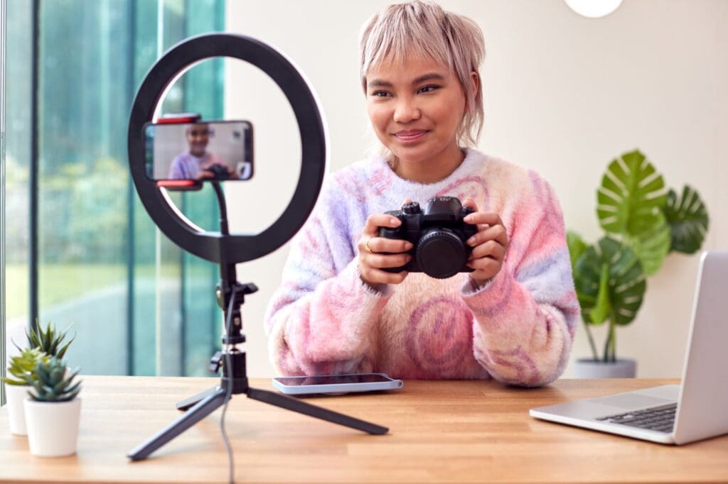 female-vlogger-recording-camera-tutorial-video - trying to make money online