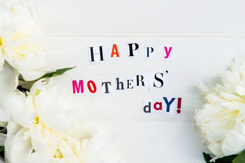 writing of happy Mother's Day with flowers on the side - for money lessons 