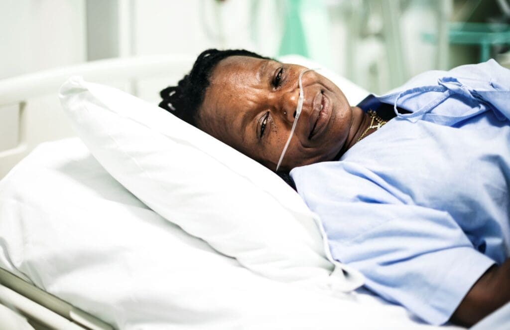 sick-woman-in-a-hospital-bed-
