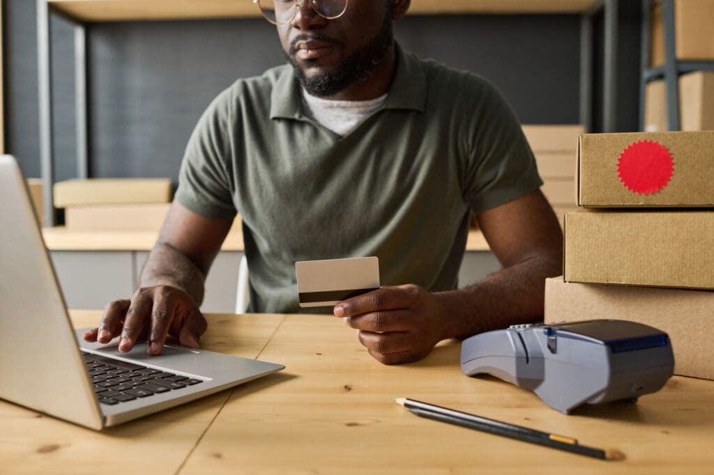 Man doing online shopping with credit card