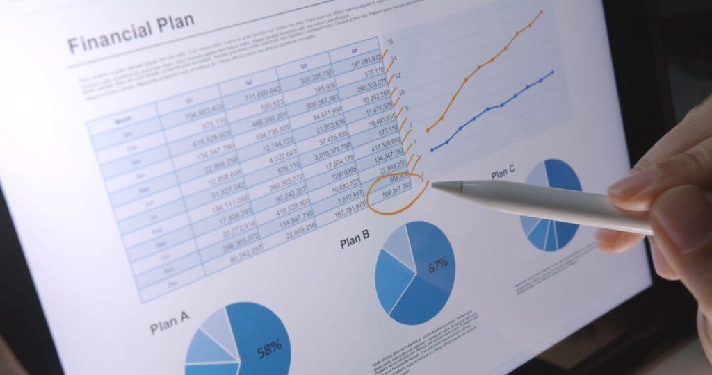Close-up hand use pen write check growth data number on touch screen