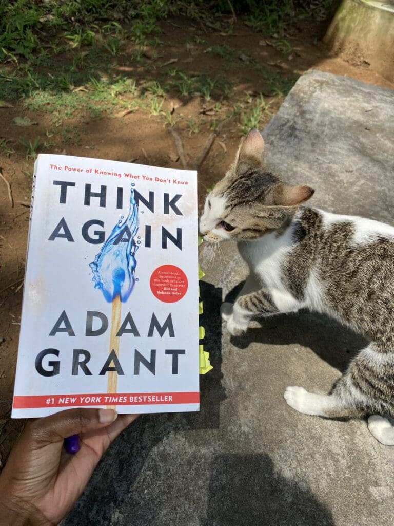 Why We Sleep Unlocking the Power of Sleep and Dreams with a glass of juice with a cat in the background