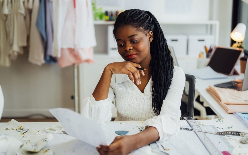 Profession dressmaker designer working in workshop studio