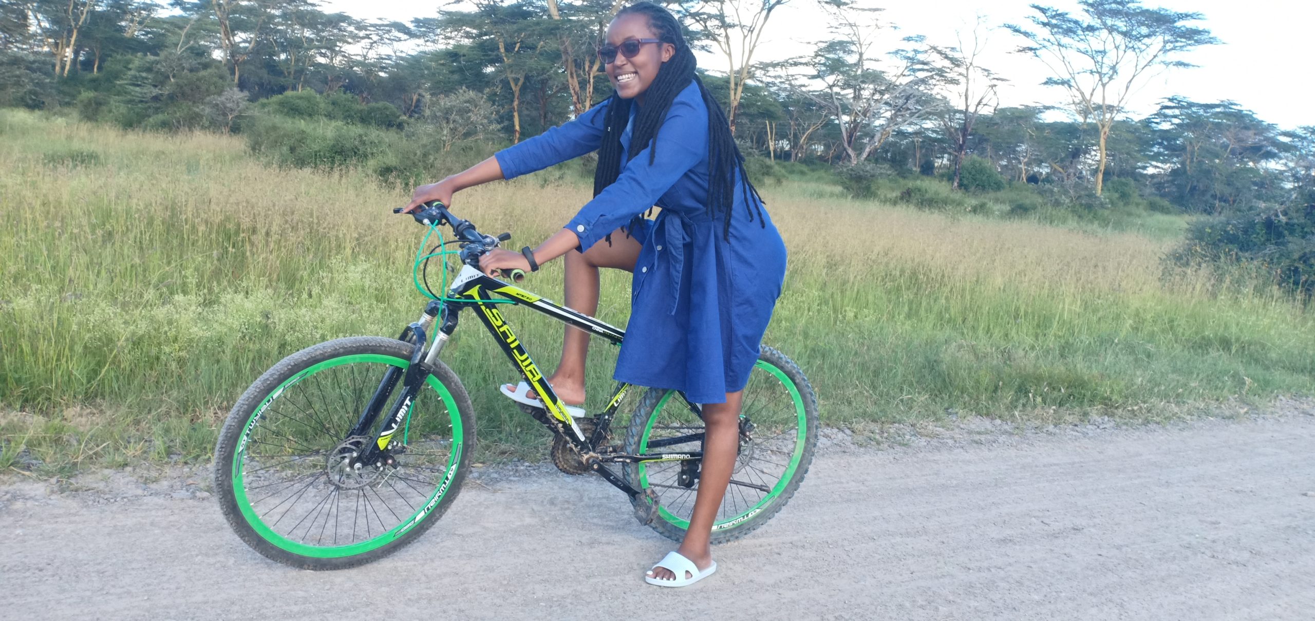 A young lady riding a bike at Swara Acacia Lodge
