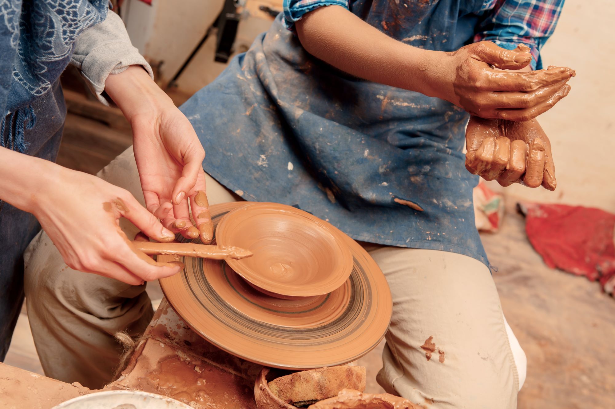 Two people making pottery as a profitable hobbies