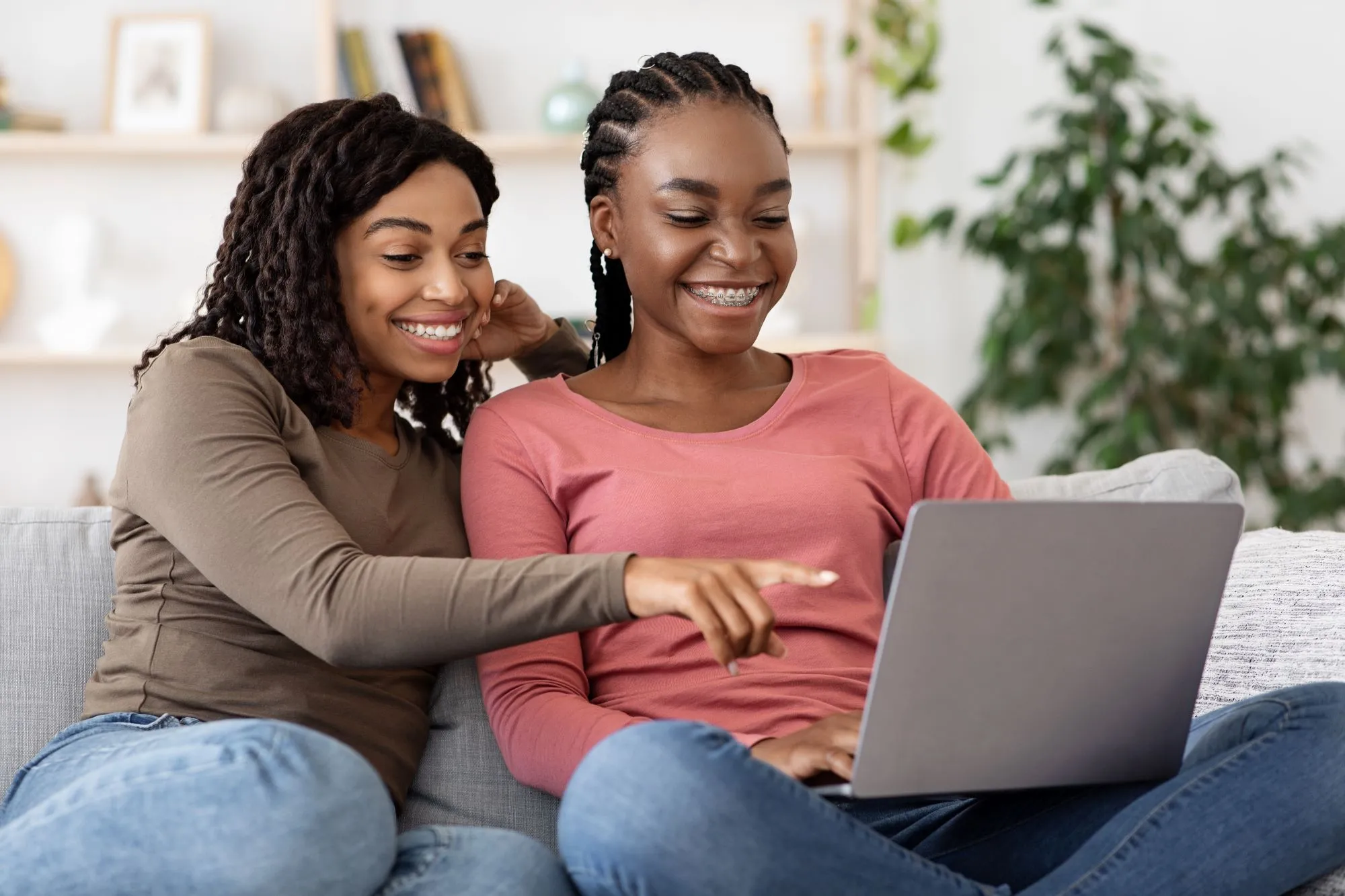happy-black-women-using-laptop-at-home-Table Banking-
