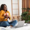 african-woman-hugging-gift-box-during-video-call-financial planners to gift