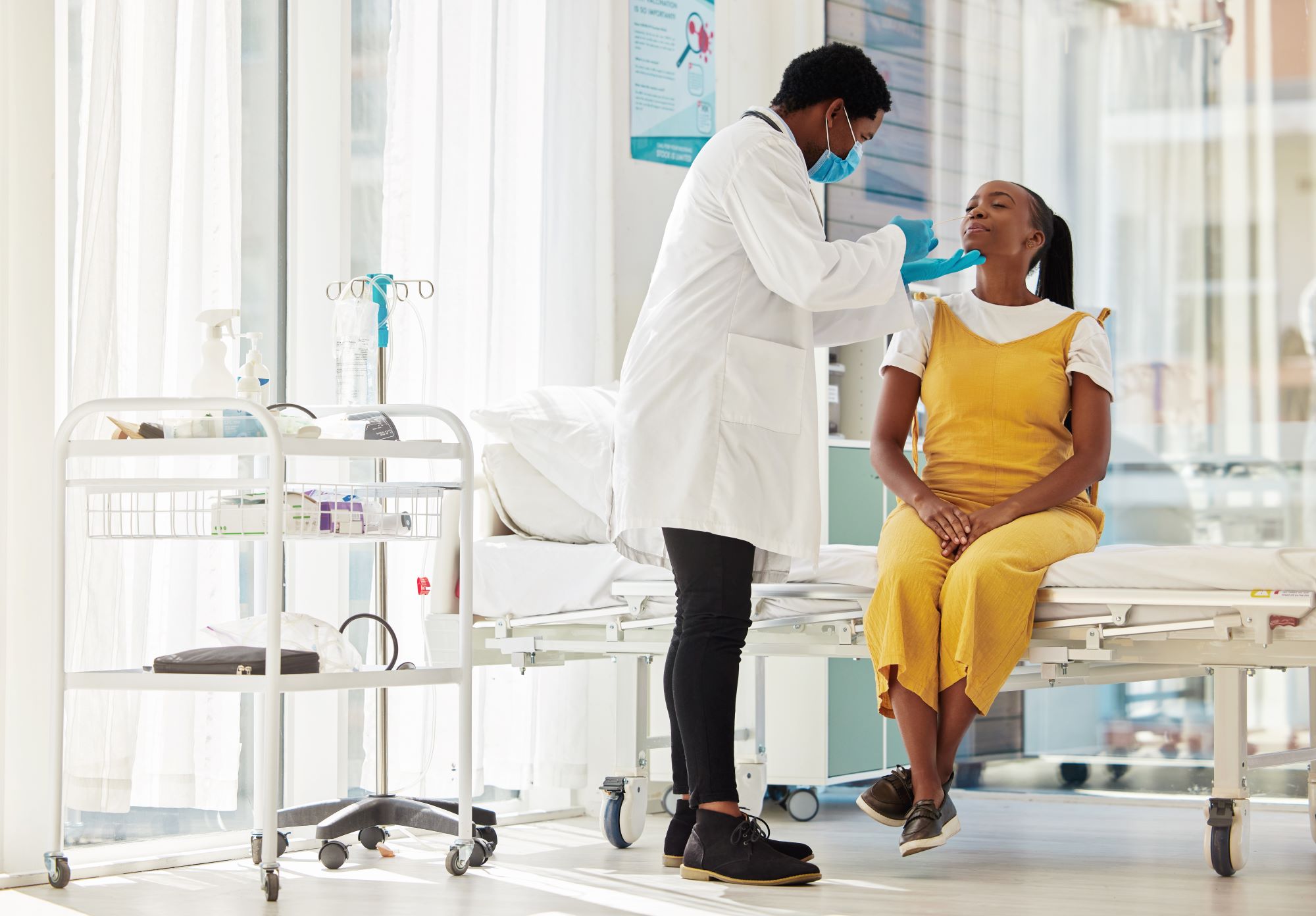 black woman patient talking to a doctor for consulting during-health insurance in Kenya
