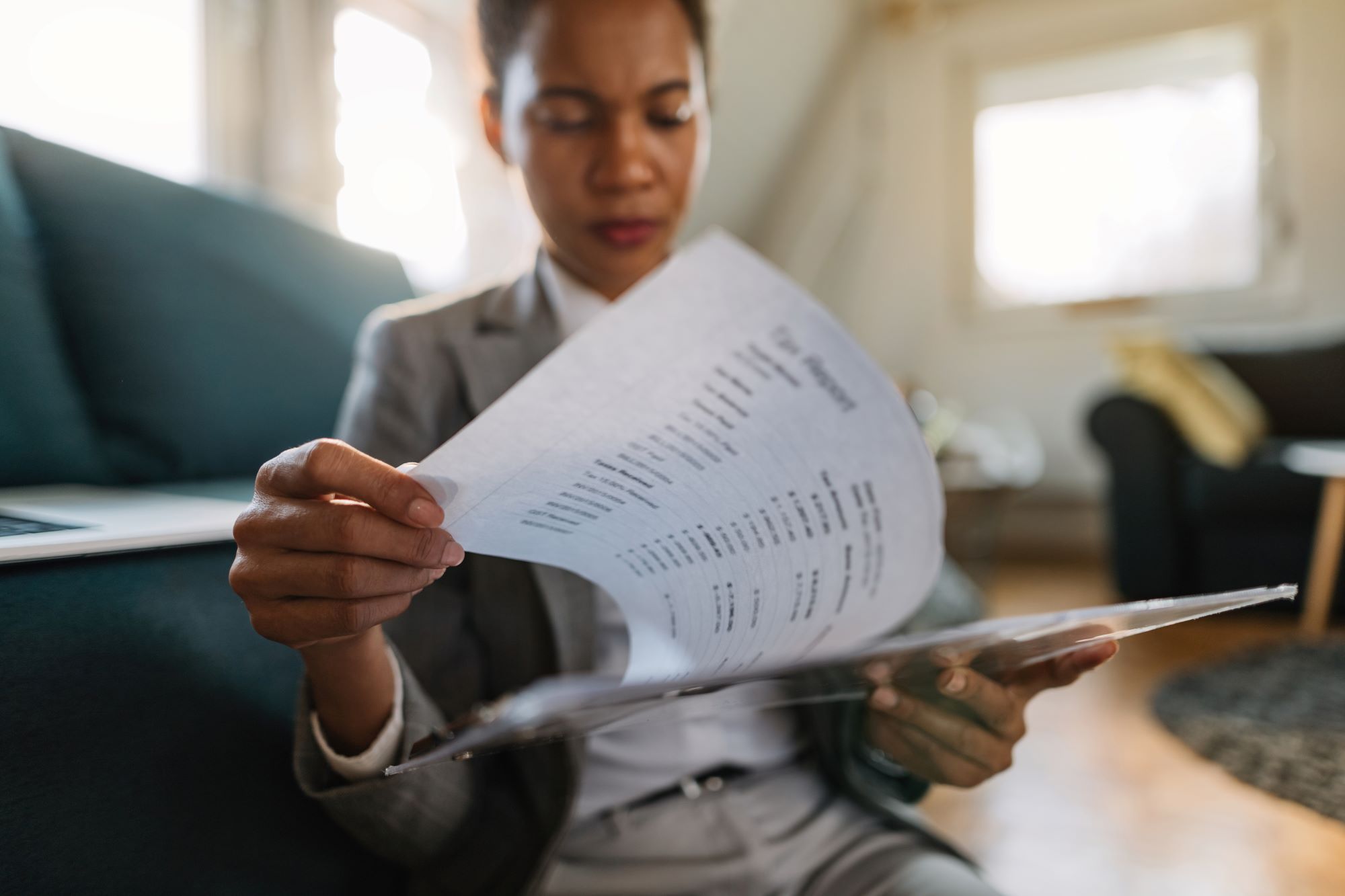 Close-up of African businesswoman analyzing business finances at home-How to Read an Income Statement For Your Small Business